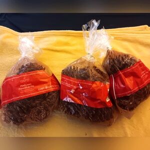 Three bags of decorative scented pine cones